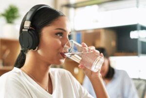 woman drinking a glass of water